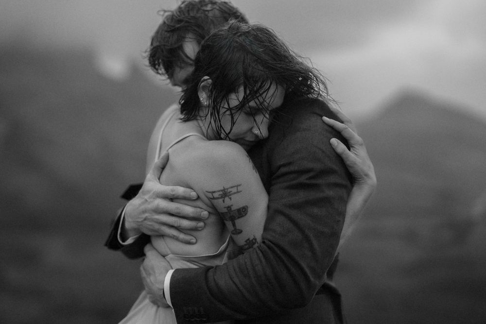 Couple hold each other tight after sharing their vows during their Isle of Skye elopement, Scotland